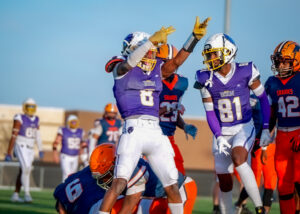 Capital City Bison Running Back Ty Hill celebrates after a big run.